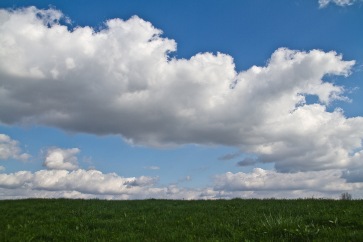 Springtime Cloudscape over Lush Green Field in Rural Indiana