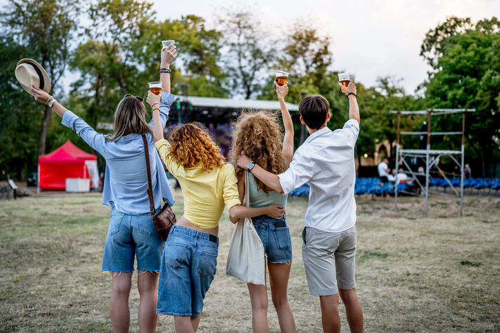 Group of friends celebrating music festival togetherness