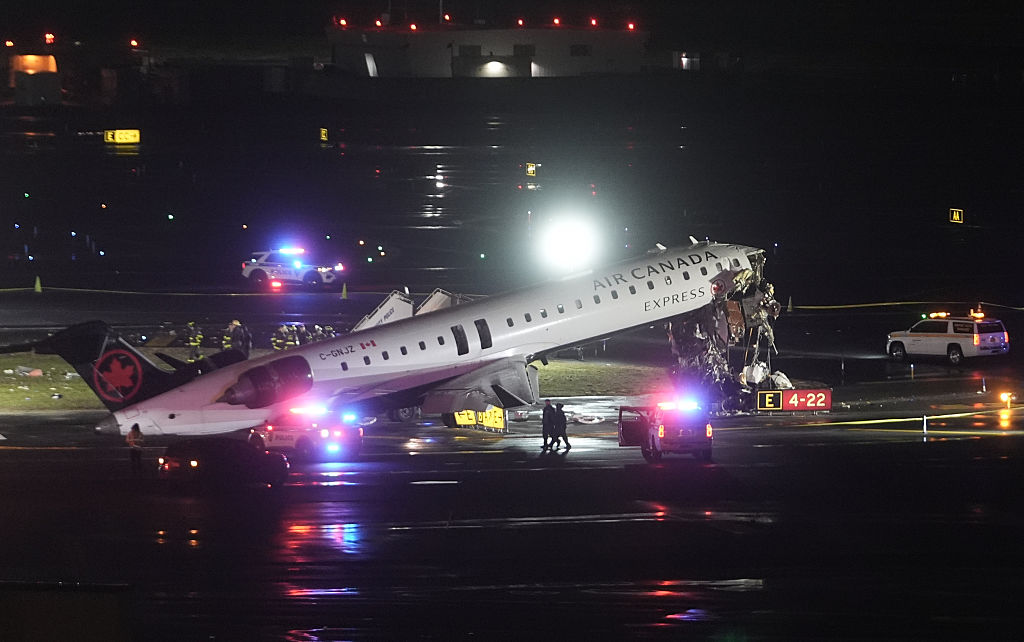 Air Canada plane collides with fire truck at LaGuardia, killing 2, injuring others