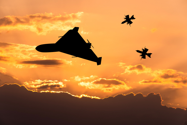Interceptor drone and heavy kamikaze drone at sunset