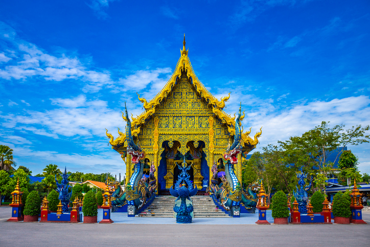 Wat Rong Sua Ten temple with blue sky background, Chiang Rai Province, Thailand, It's a popular destination and Landmark of Chiang Rai