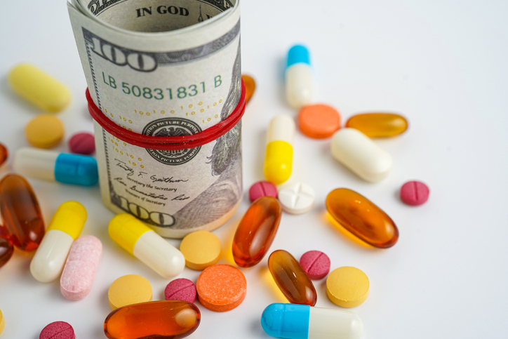 Medicine prescription drugs cost concept, Pills on money dollars, healthcare expenses