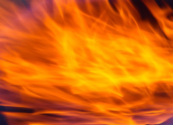Bright orange and yellow flames with pink and purple edges background asset