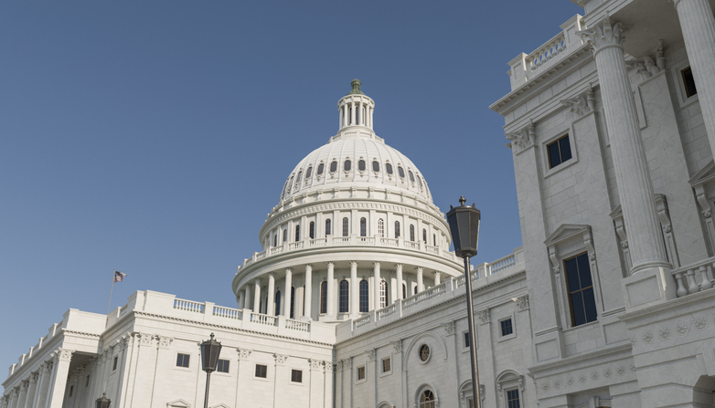 United States Capitol building dome against blue sky
