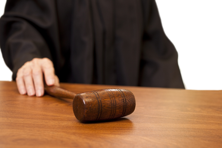 Judge in black robe with gavel