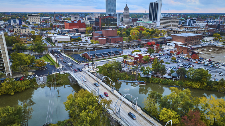 Aerial View of Fall Foliage in Urban Fort Wayne with River and Bridges