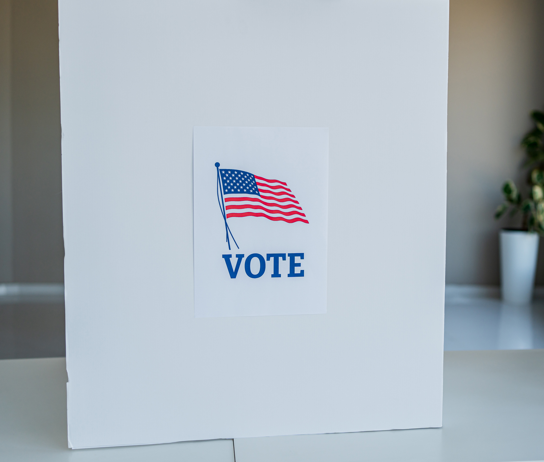 Voting booth with american flag and vote sign