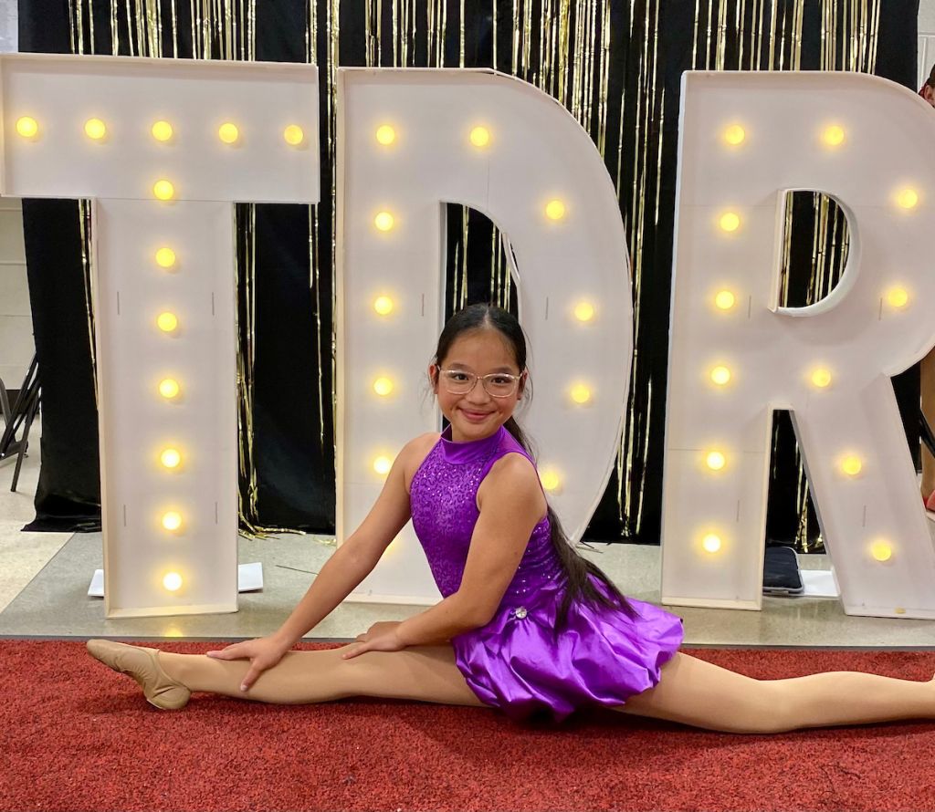 Girl in front of TDR sign
