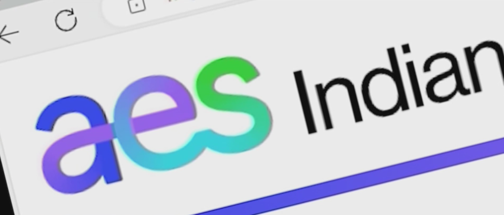 The image shows the "aes Indian" logo, which appears to be the logo for an Indian company or organization.