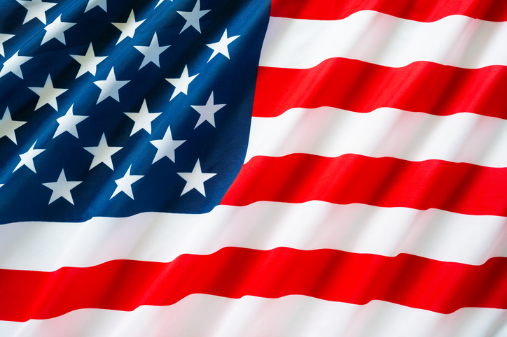 A close up of a vibrant, flowing American flag.