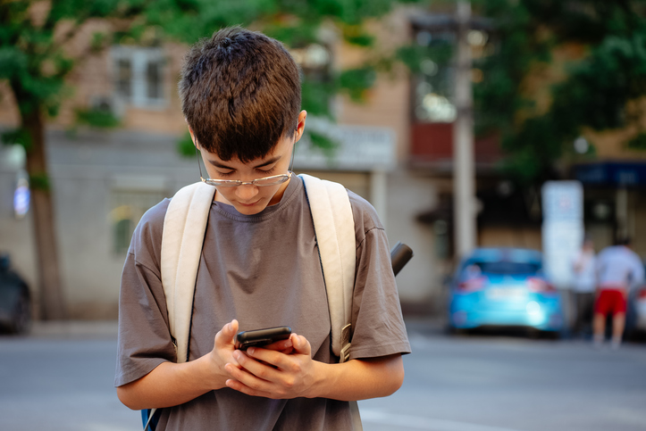 Schoolboy uses a GPS to find a shortcut to school.