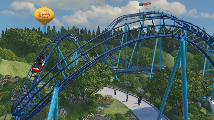 A roller coaster ride at a theme park called Holiday World, with a large yellow balloon logo visible in the sky.