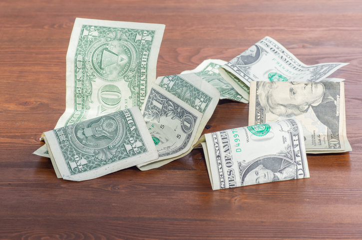 Dollar bills scattered on the table. Business concept.
