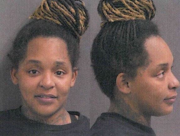 Two people with dreadlocks hairstyles, facing each other.
