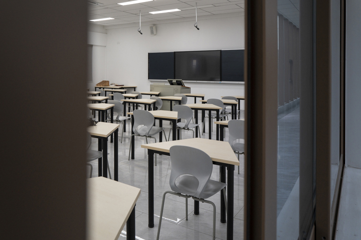 Empty Classroom with Desks and Blackboard