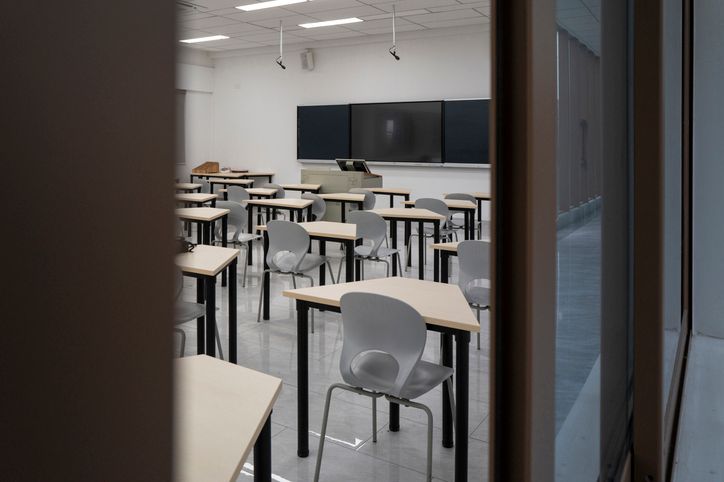 Empty Classroom with Desks and Blackboard