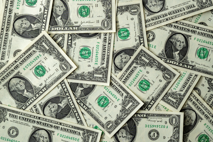 Scattered One Dollar Bills with George Washington Portraits