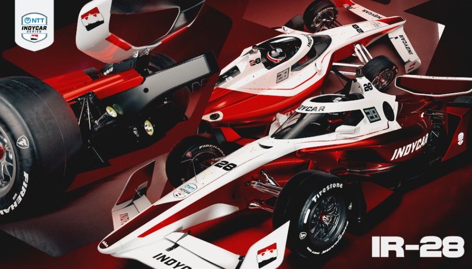 A red and white Indy car with the number 28 on the side, featuring the Indy Car and Firestone logos.