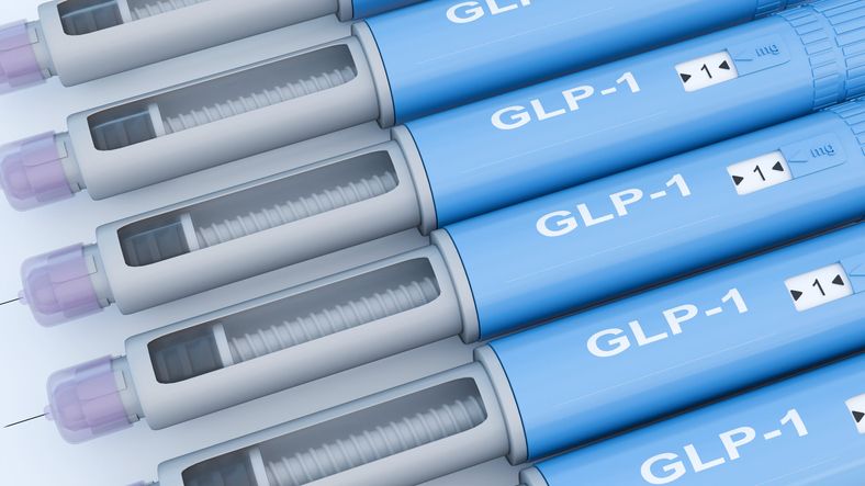 A 3D render of blue injectable medication pens. Each pen clearly displays the text "GLP-1".