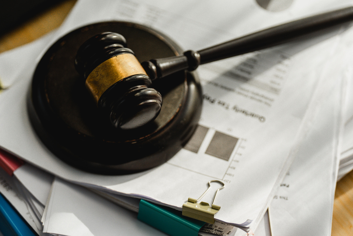 Court Gavel on Business Paperwork for Legal Consultation and Contract Review