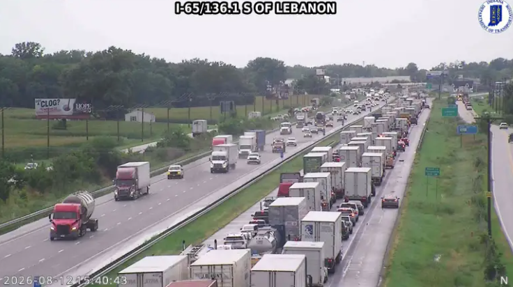 I-65/136.1 S of Lebanon: Busy highway with multiple lanes of traffic, including cars, trucks, and tractor-trailers, moving in both directions.